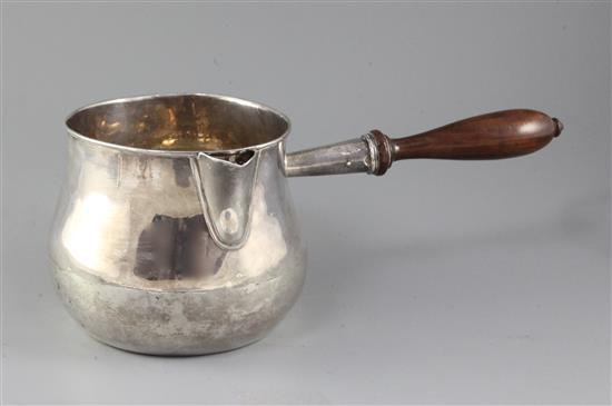 A large 18th century? silver bulbous saucepan with turned lignum vitae handle, gross 30 oz.